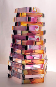 sculpture of multiple rows of stacked bars of colored glass 